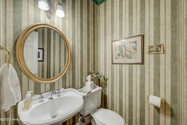 bathroom with sink and toilet