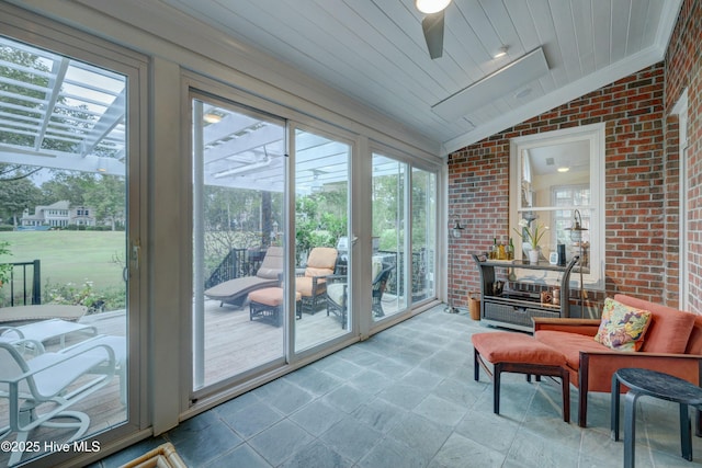 sunroom / solarium with wood ceiling and vaulted ceiling