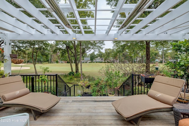 deck featuring a yard and a pergola