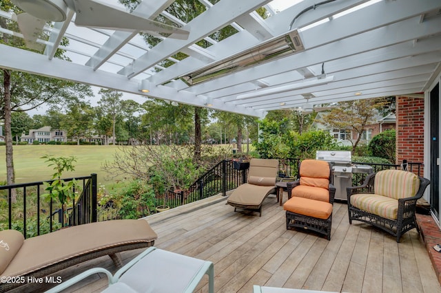 deck with area for grilling, a pergola, and an outdoor hangout area