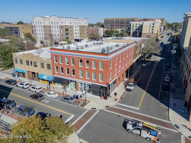 birds eye view of property with a view of city