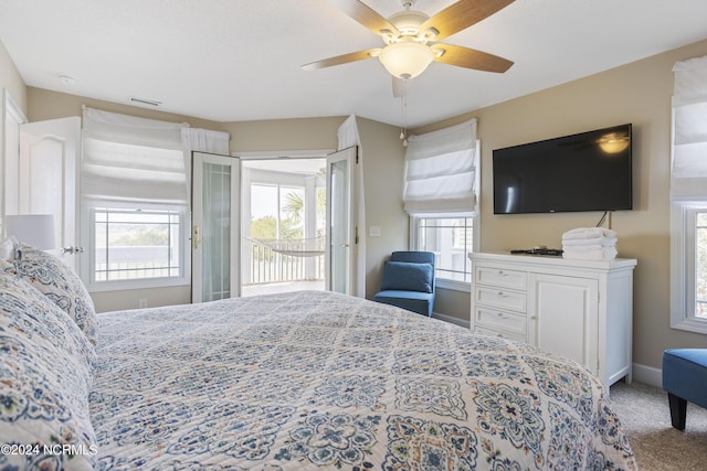 carpeted bedroom with access to exterior, visible vents, baseboards, and a ceiling fan