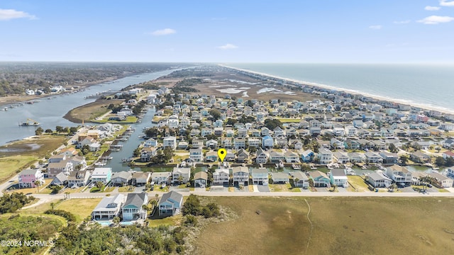 drone / aerial view with a water view and a residential view