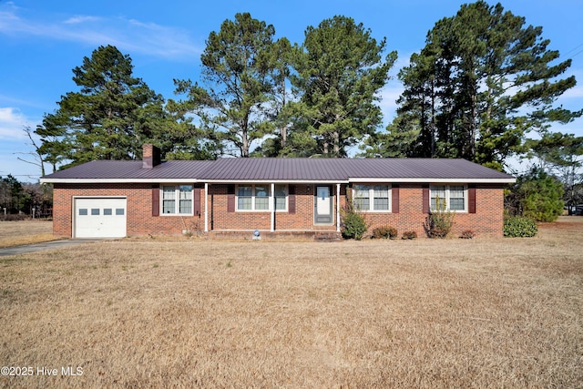 ranch-style home with a garage and a front yard