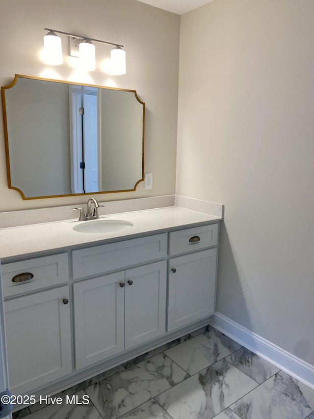 703 Henry Ln, Tarboro, NC 27886 - bathroom featuring vanity, baseboards, and marble finish floor