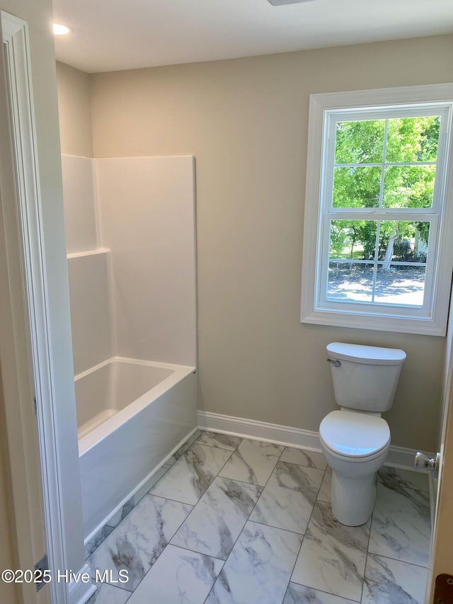703 Henry Ln, Tarboro, NC 27886 - bathroom with toilet, marble finish floor, and baseboards