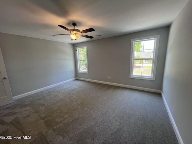 703 Henry Ln, Tarboro, NC 27886 - carpeted spare room featuring baseboards, visible vents, and a ceiling fan