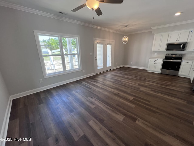 703 Henry Ln, Tarboro, NC 27886 - interior space with ceiling fan with notable chandelier, dark wood finished floors, visible vents, baseboards, and ornamental molding