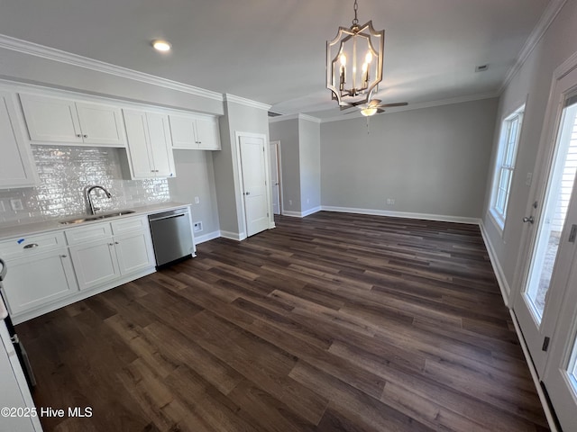 703 Henry Ln, Tarboro, NC 27886 - kitchen featuring stainless steel dishwasher, a sink, ceiling fan with notable chandelier, white cabinetry, and light countertops
