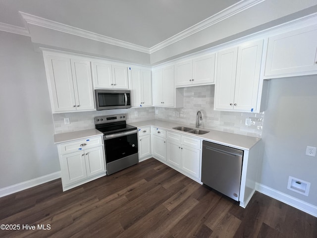 703 Henry Ln, Tarboro, NC 27886 - kitchen with a sink, white cabinetry, baseboards, and appliances with stainless steel finishes