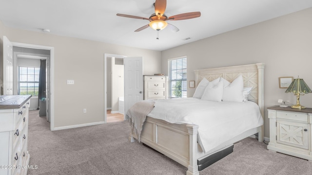 bedroom featuring ceiling fan and light carpet