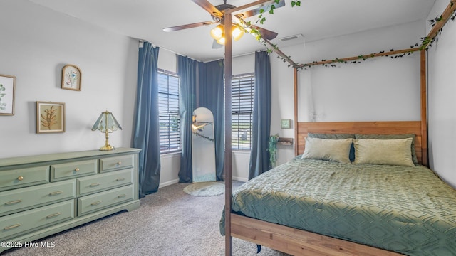 bedroom with ceiling fan and carpet