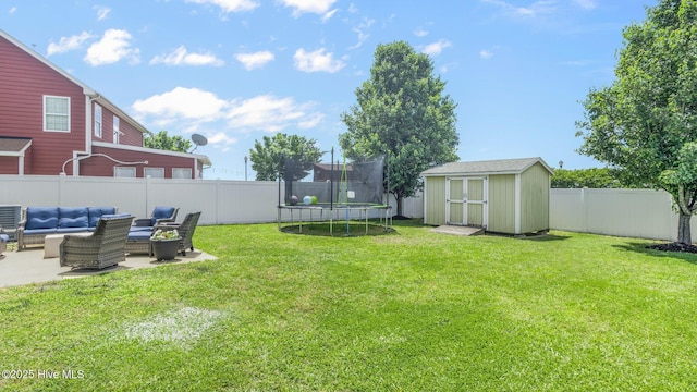 view of yard with a shed, a trampoline, a patio area, and outdoor lounge area