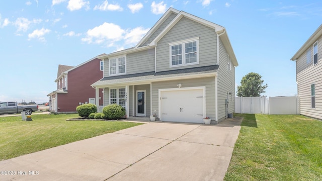 view of front of property featuring a garage and a front yard