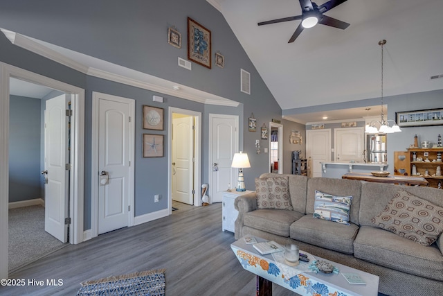 living room featuring crown molding, high vaulted ceiling, wood-type flooring, and ceiling fan