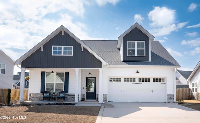 view of front of home featuring a garage and covered porch