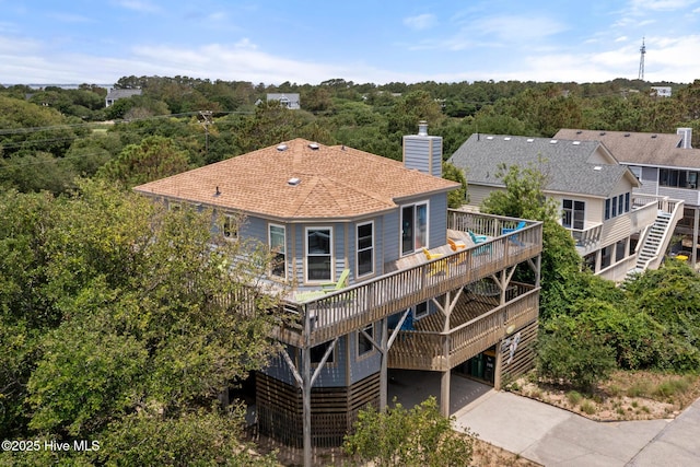 rear view of house featuring a carport