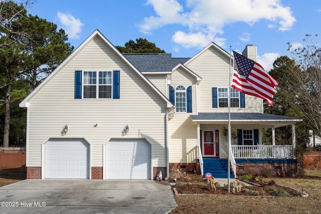 view of front facade with a garage and a porch