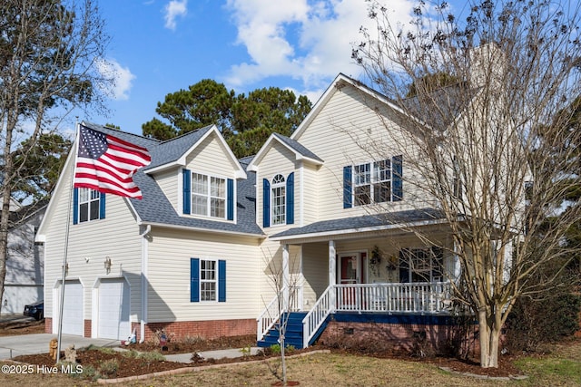 view of front of house featuring a garage and a porch