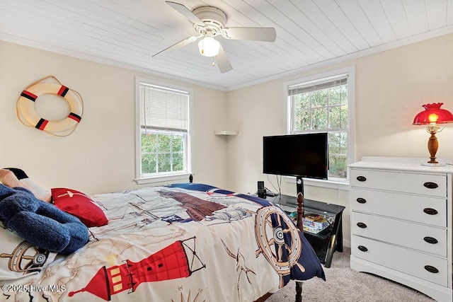 bedroom with crown molding, ceiling fan, wood ceiling, and light carpet