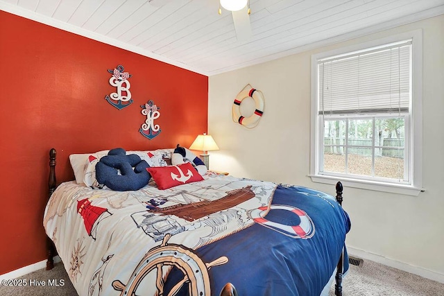 bedroom featuring carpet floors and wood ceiling