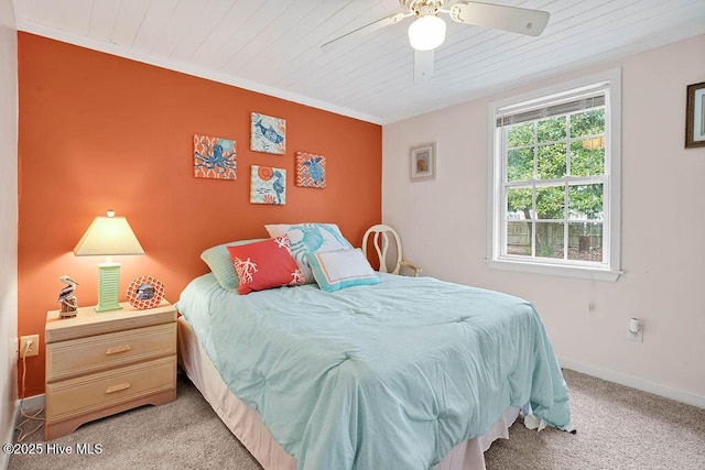 carpeted bedroom featuring wood ceiling and ceiling fan