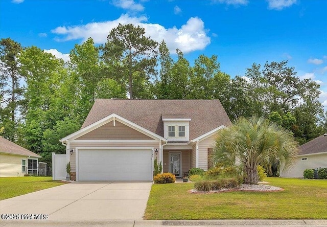 view of front of house with a garage and a front yard