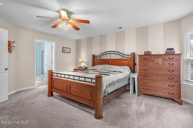 bedroom featuring light colored carpet and ceiling fan