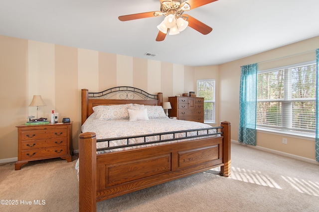 bedroom with light carpet and ceiling fan