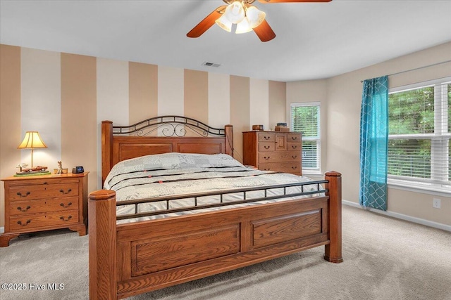 bedroom featuring multiple windows and light colored carpet