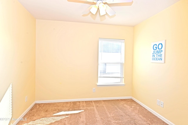 unfurnished room featuring light carpet and ceiling fan