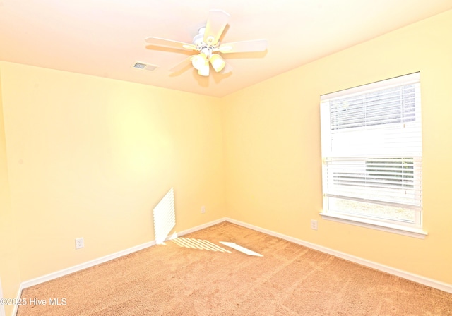 carpeted empty room with ceiling fan