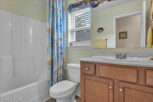 full bathroom with shower / tub combo with curtain, vanity, and toilet