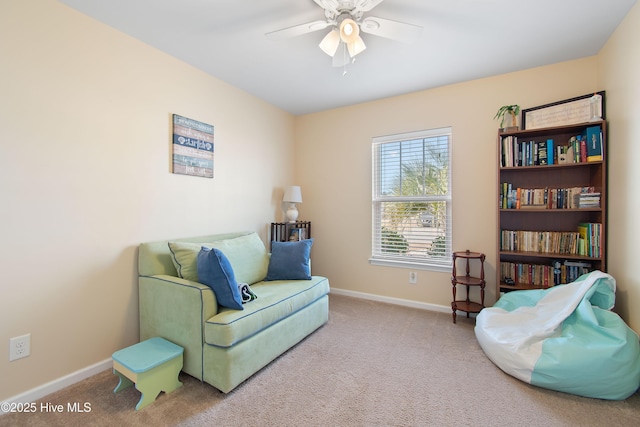 sitting room featuring carpet flooring and ceiling fan