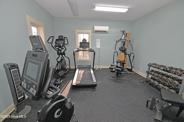 gym featuring a wall mounted air conditioner