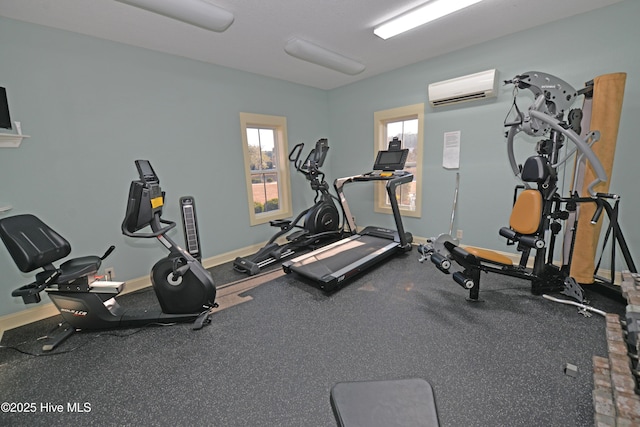 workout room with a wall mounted air conditioner