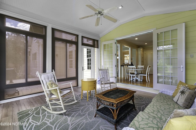 sunroom featuring vaulted ceiling and ceiling fan