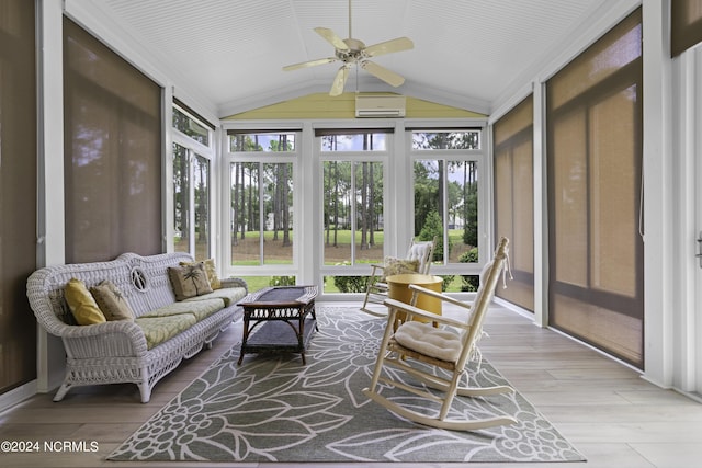 sunroom featuring lofted ceiling, a wall mounted AC, and ceiling fan