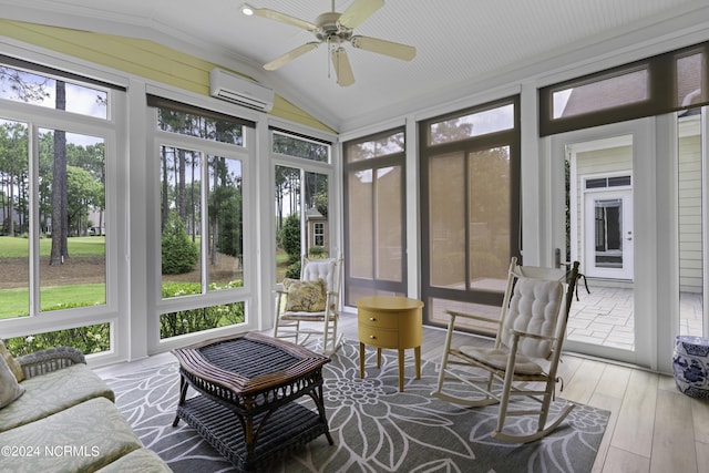 sunroom / solarium featuring ceiling fan, lofted ceiling, and a wall unit AC