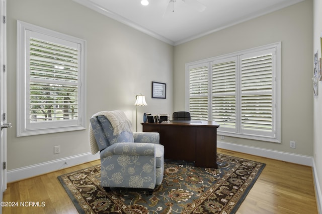 office with crown molding, hardwood / wood-style flooring, and ceiling fan