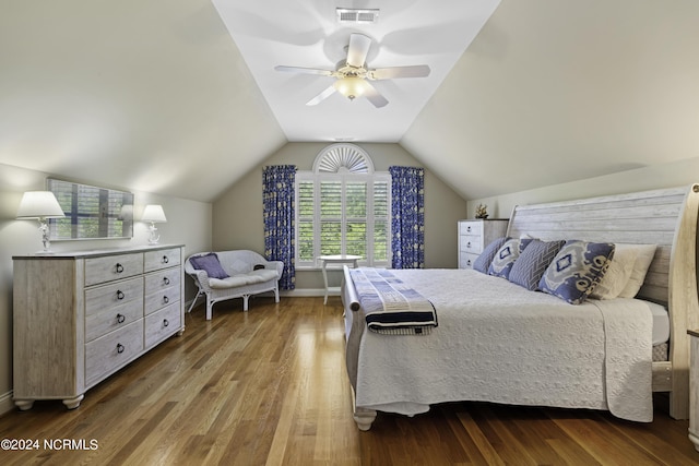 bedroom with vaulted ceiling, hardwood / wood-style floors, and ceiling fan