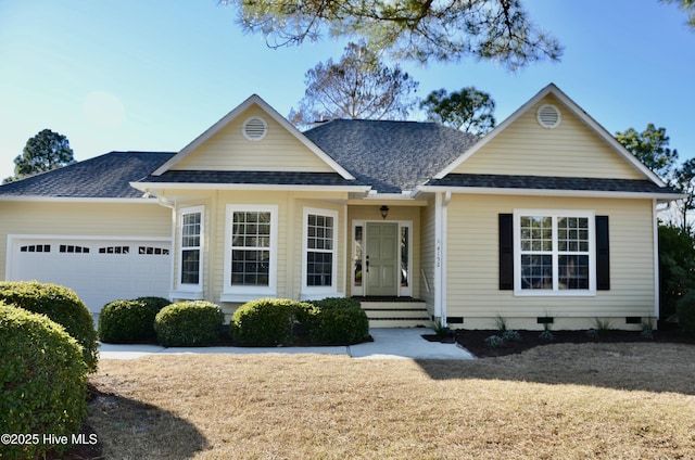 view of front of property with crawl space, an attached garage, and a shingled roof