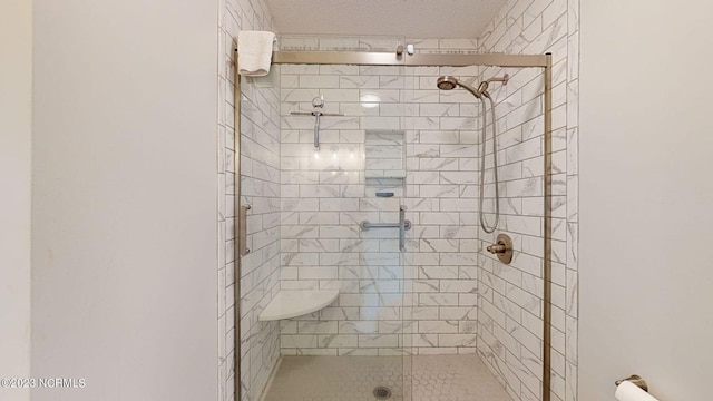 bathroom featuring a shower with door