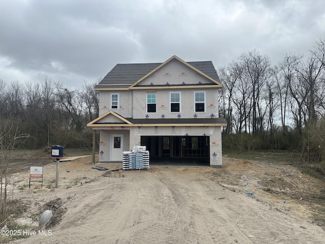 property under construction with a garage and driveway