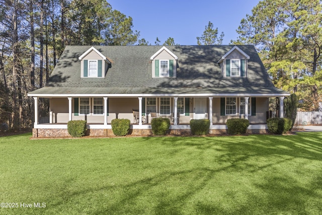 cape cod-style house with a front lawn and a porch