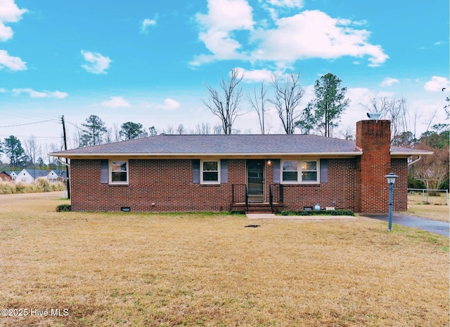 ranch-style house featuring a front lawn