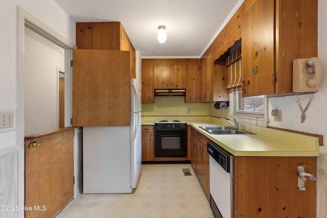 kitchen with white appliances and sink