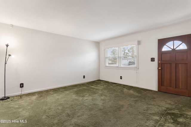 foyer with dark colored carpet