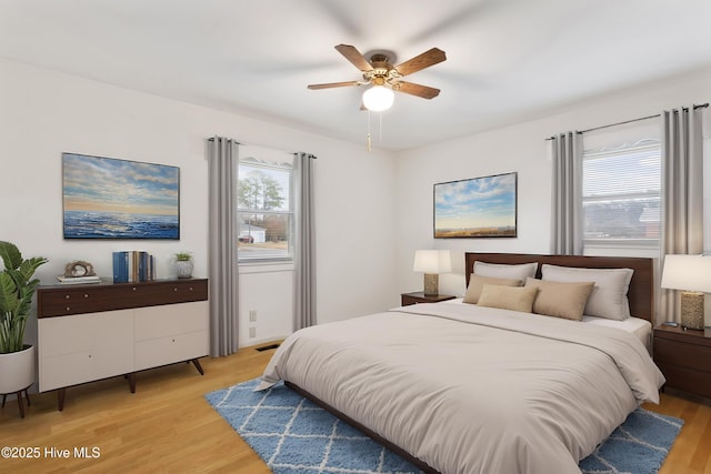 bedroom featuring ceiling fan and light hardwood / wood-style floors