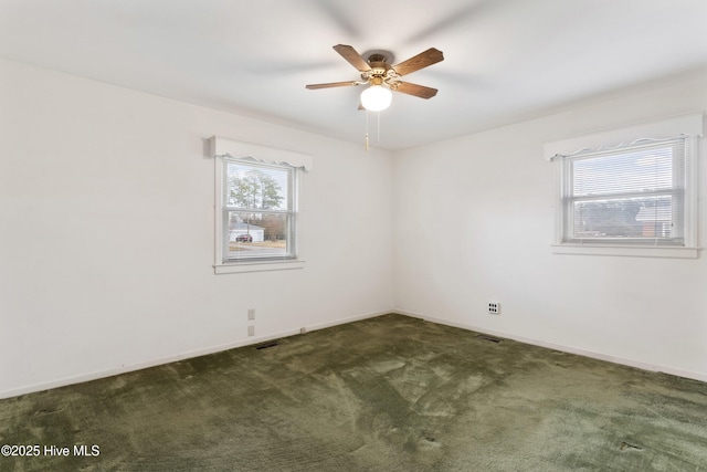 carpeted empty room with ceiling fan